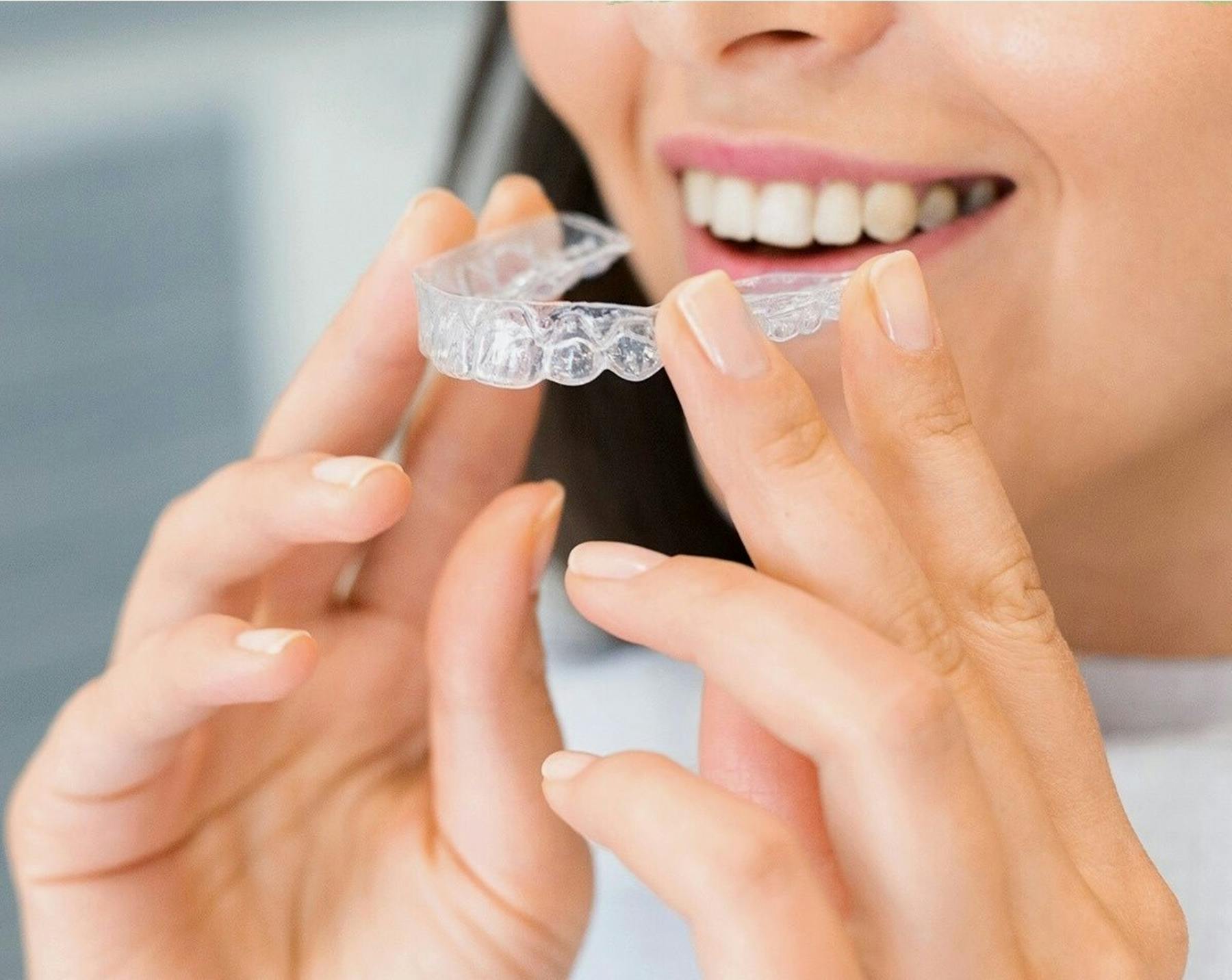 Woman with clear dental aligner